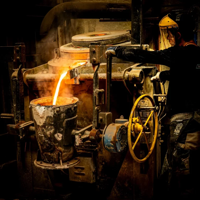 filling crucible with molten bronze photo credits florent stein